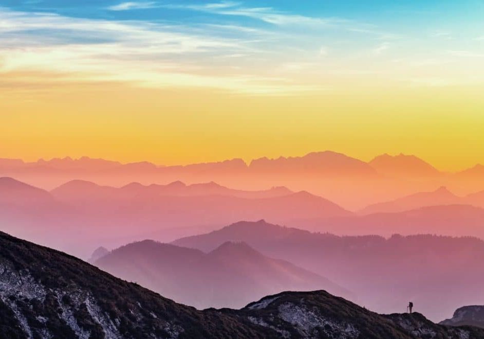 A rainbow of colors on a mountain range at sunrise